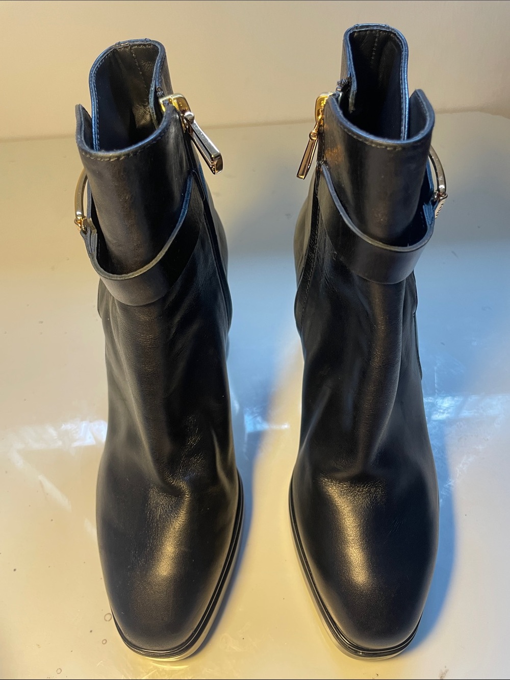 Tod's Black Leather Ankle Booties with Gold Hardware